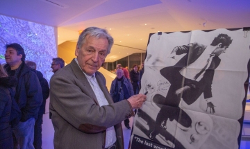 Oscar-winning director Costa-Gavras signs a promotional poster for his film Z.